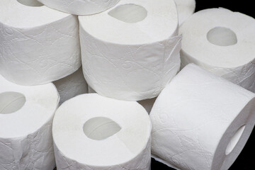 Rolls of toilet paper. Lots of toilet paper rolls.  Soft hygienic paper