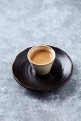 Cup of coffee on rustic wooden background. Copy space