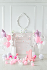 One year birthday decorations. A lot of balloons pink and white colors. 
