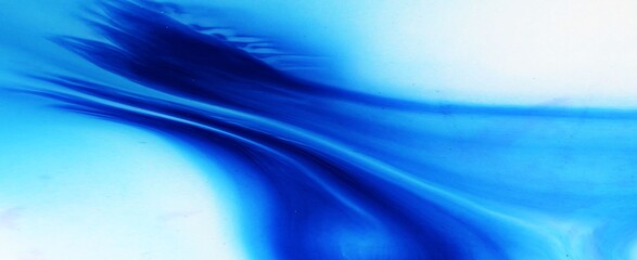 Blue abstract background. Alcohol ink flows freely and creates an intricate pattern. The feather of...