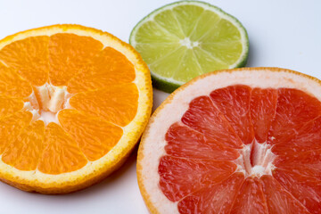 Fototapeta na wymiar Orange grapefruit and lime citruses on a white background isolate