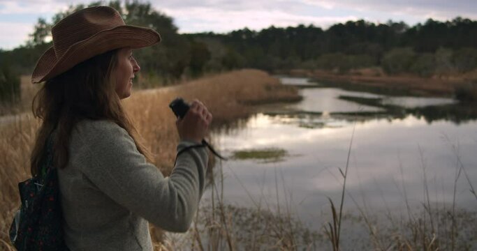 Explorer girl looking for wildlife while hiking