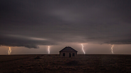 Dramatic Lightning Storm Over an Abandoned Building on the Great Plains