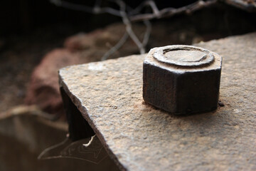 pice of construction metal with metal bolt