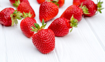Fresh strawberries. On a white wooden background