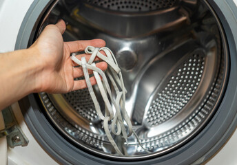 washing in a washing machine white shoelaces from sneakers