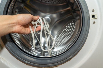 washing in a washing machine white shoelaces from sneakers