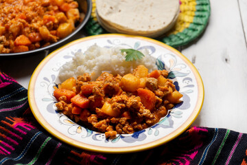 Mexican picadillo with rice on white background