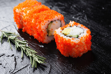 California rolls on a black plate