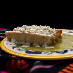 Mexican drowned flautas with green sauce also called 