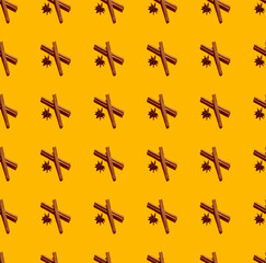Cinnamon quills and star anise fruits seamless pattern isolated on yellow