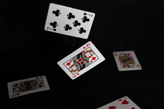 Floating Playing Cards on a Black Background