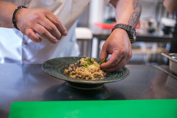 serving dishes on a plate in a professional kitchen close up