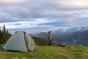 hiker with equipment spends time hiking in the mountains