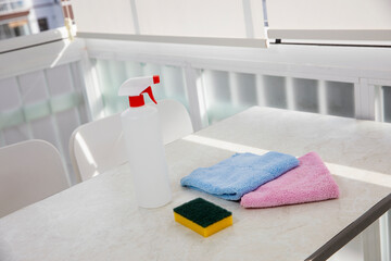 Cleaning products on white table in house