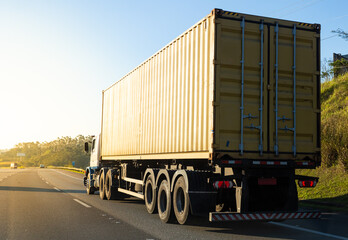 Truck transporting container on the road
