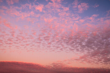 Amazing sunset sky with cloud pattern in blue, pink, purple, orange and other colors over Santiago, Chile