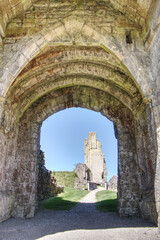 Fototapeta na wymiar Helmsley Castle gate with tower in the background. North York Moors National Park, North Yorkshire, England