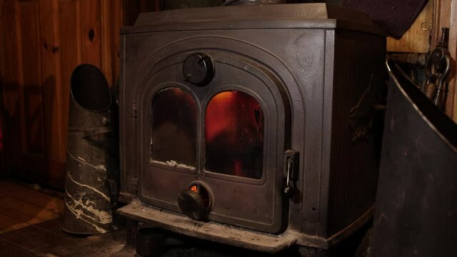Cast Iron stove with back boiler running on coal