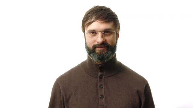 Professional and confident finance top manager wearing eye glasses and casual clothes looking on the camera isolated on white background