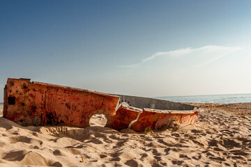 Abandoned, old, dilapidated boat carcass on a Baltic sea beach.