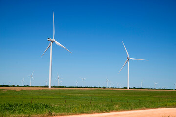 wind turbines in a field of wheat