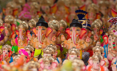 Little statues of indian god Ganesha.