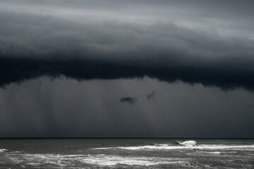 Menacing Tempest: Dark Storm Clouds Over the Furious Sea