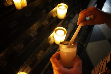 Lighting a candle for the deceased