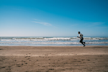 Portrait of an athletic man running.