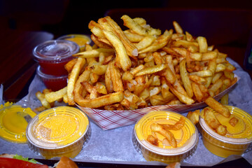 Fries with cheese and ketchup