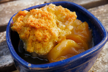 Close Up of Peach and Biscuit Dessert in Blue Bowl