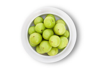 Closeup Indian gooseberry fruits ( phyllanthus emblica, amla ) in white ceramic bowl isolated on white background. Top view. Flat lay. Clipping path.