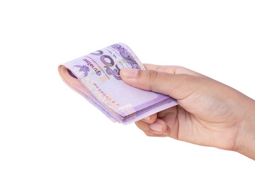 Closeup man hand holding money Thai banknotes isolated on white background with clipping path. Hand giving money or business payment concept.