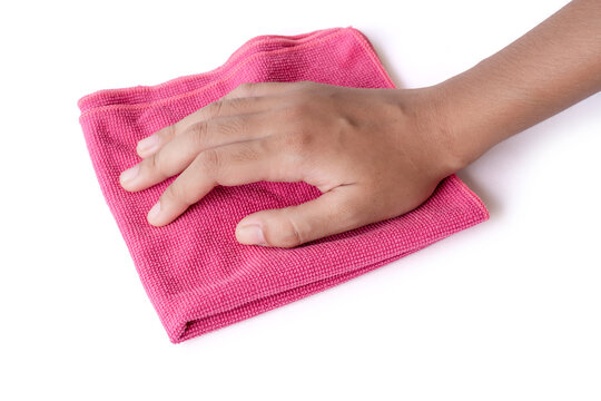 Closeup Female Hand Holding Pink Duster Microfiber Cloth For Cleaning Isolated On White Background With Clipping Path.