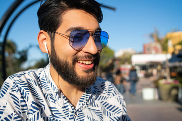 Man listening to music with earphones.