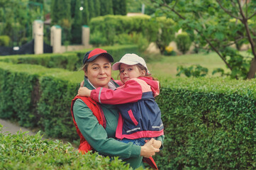 Fototapeta premium Mother with a little daughter on a walk . Outdoor family walks