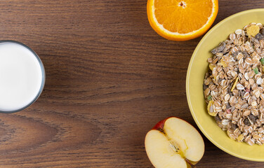 muesli with milk and fruit. top view, copy space. Fresh granola. concept of proper nutrition and a...