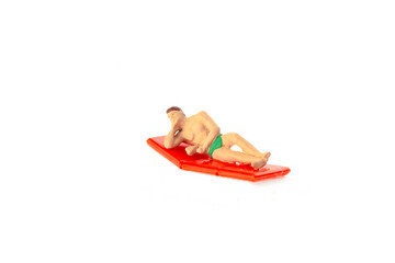 Miniature people office, worker and swimming beach sport concept in variety action on white background 