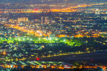 Obraz premium Beautiful of Landscape View cityscape over The color of the lights and city center of Chiang mai,Thailand at twilight night background.