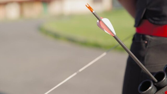archery arrow pulled out of the holster when shooting from a bow at a target