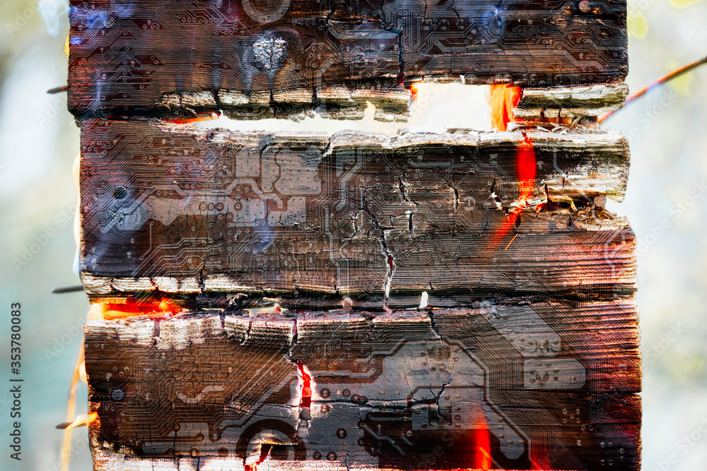 Poster burning log with silhouette of the computer motherboard. circuit board. electronic computer hardware