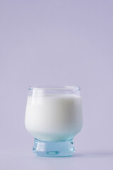cup of cold milk on white background.