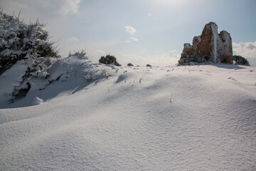 Uluzzo tower after a exceptional snowfall, Salento, Italy