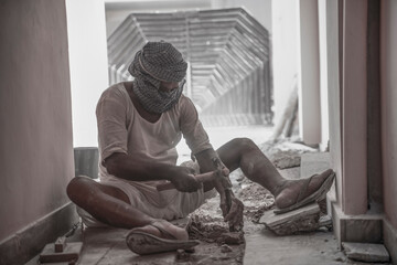  jaipur. Rajasthan. India - may 21, 2020 Asia people work hard about construction in factory with wearing mask (covid19 )