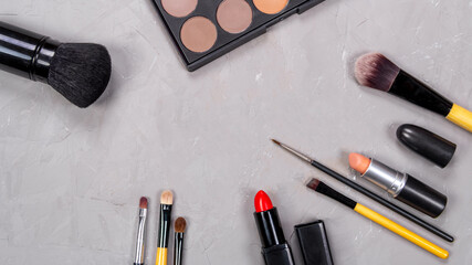 Unfolded open cosmetics on a gray background