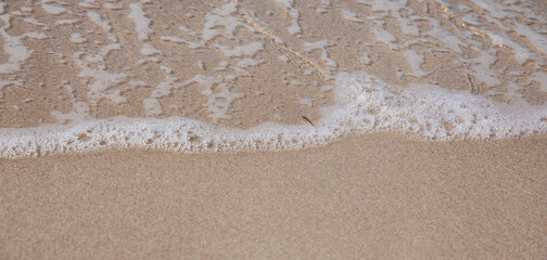 Sand with water on the beach