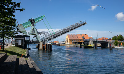 Bridge opening for a ship with blue sky and clouds