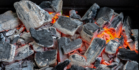 The coals in the grill for cooking as background