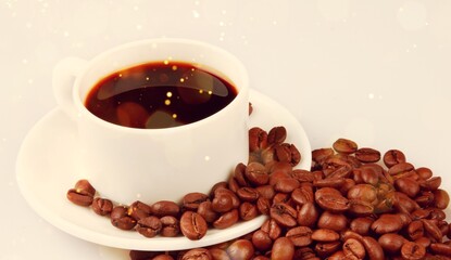 A cup of fresh coffee and coffee beans on the desk